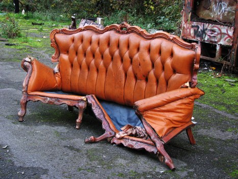 Vans lined up for commercial waste removal on a village street in Blackheath
