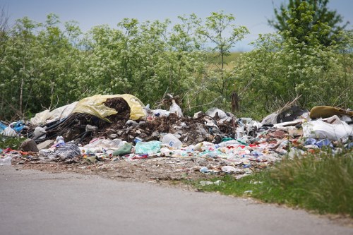Workers sorting recyclable materials at a local transfer station
